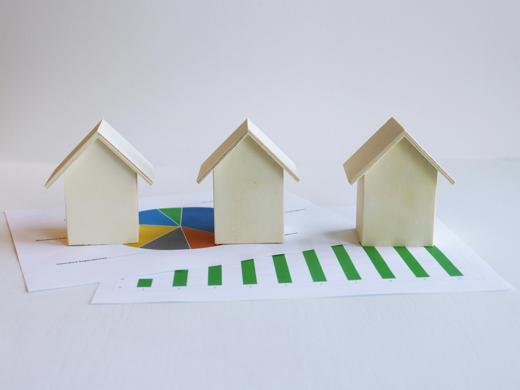 Model of houses on pages showing graphs