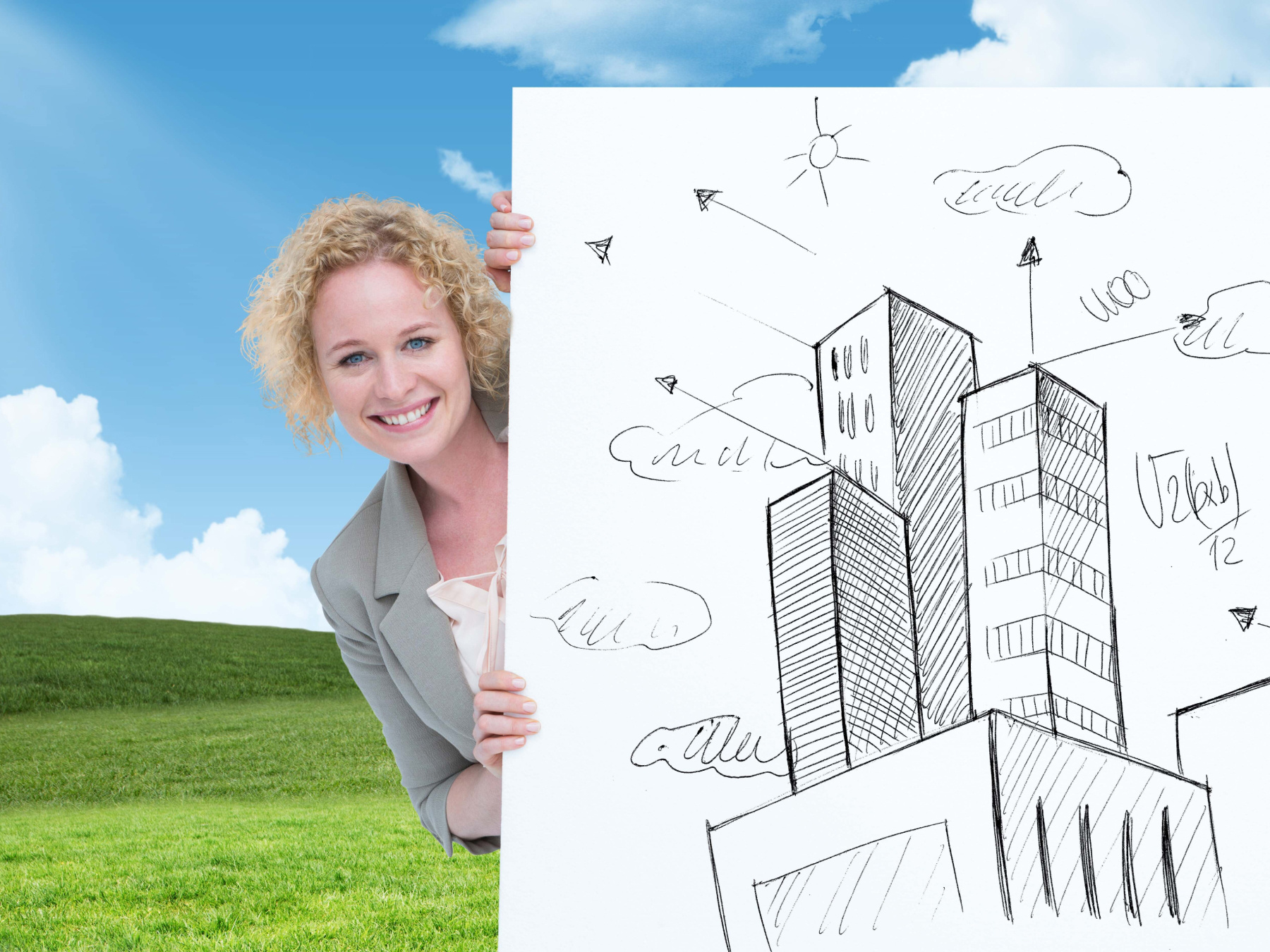 A woman holds up a poster that shows an illustration of a building