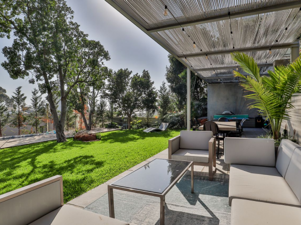 Outdoor area with coffee table and couches