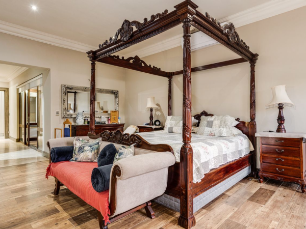 Alternate angle of four-poster bed in vintage bedroom