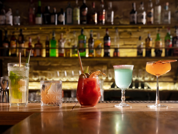 Assortment of cocktails on home bar counter