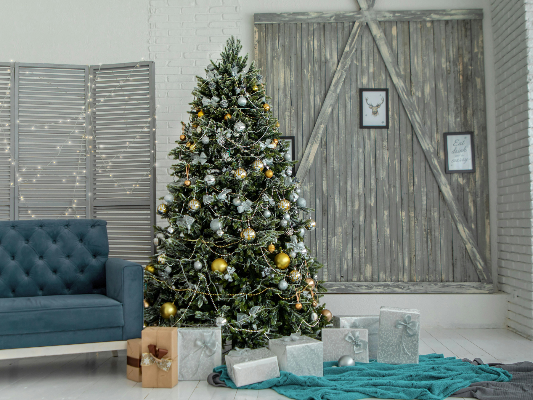 Christmas tree surrounded by presents in a modern home