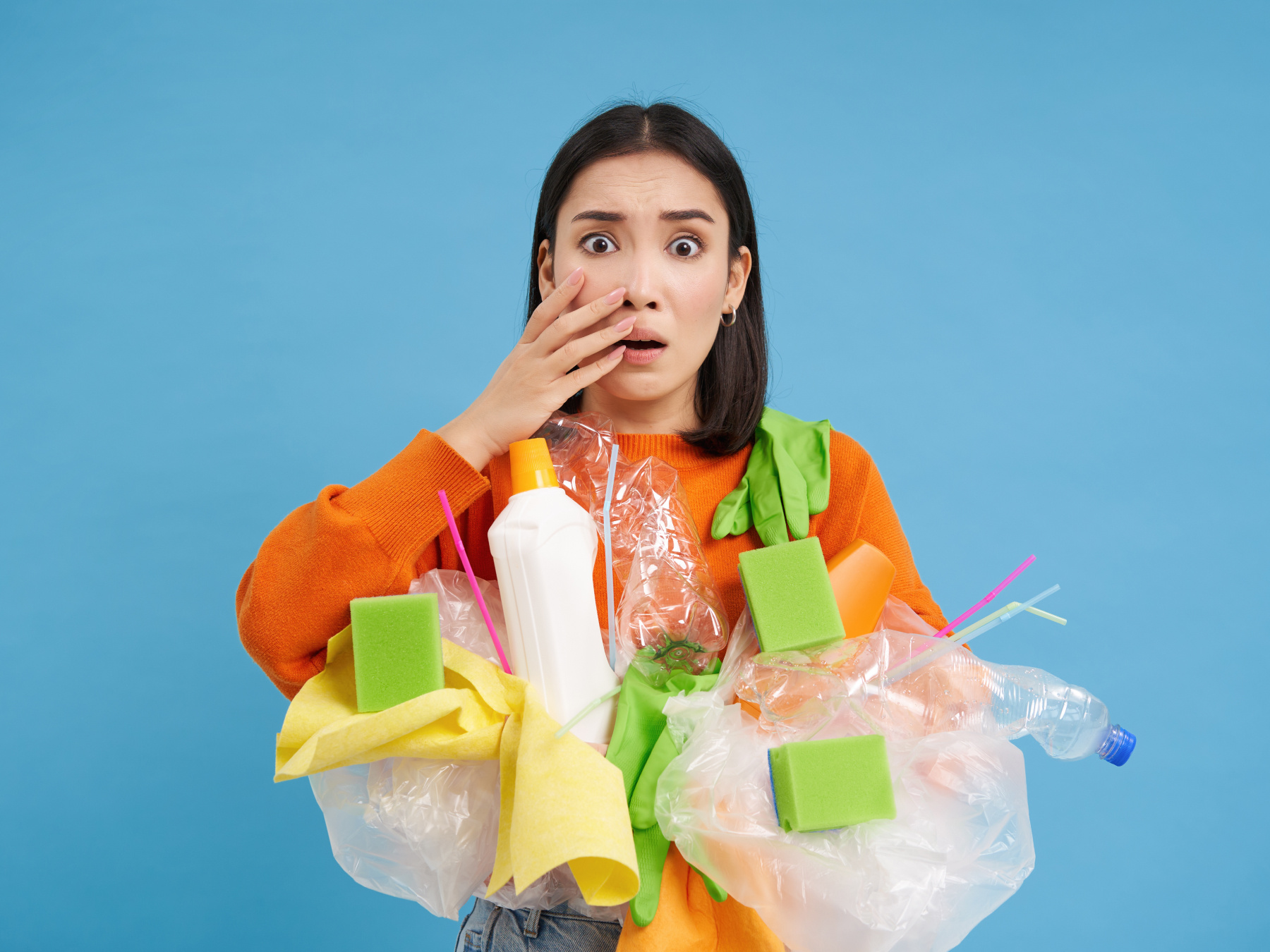 Woman carries eco-friendly cleaning supplies