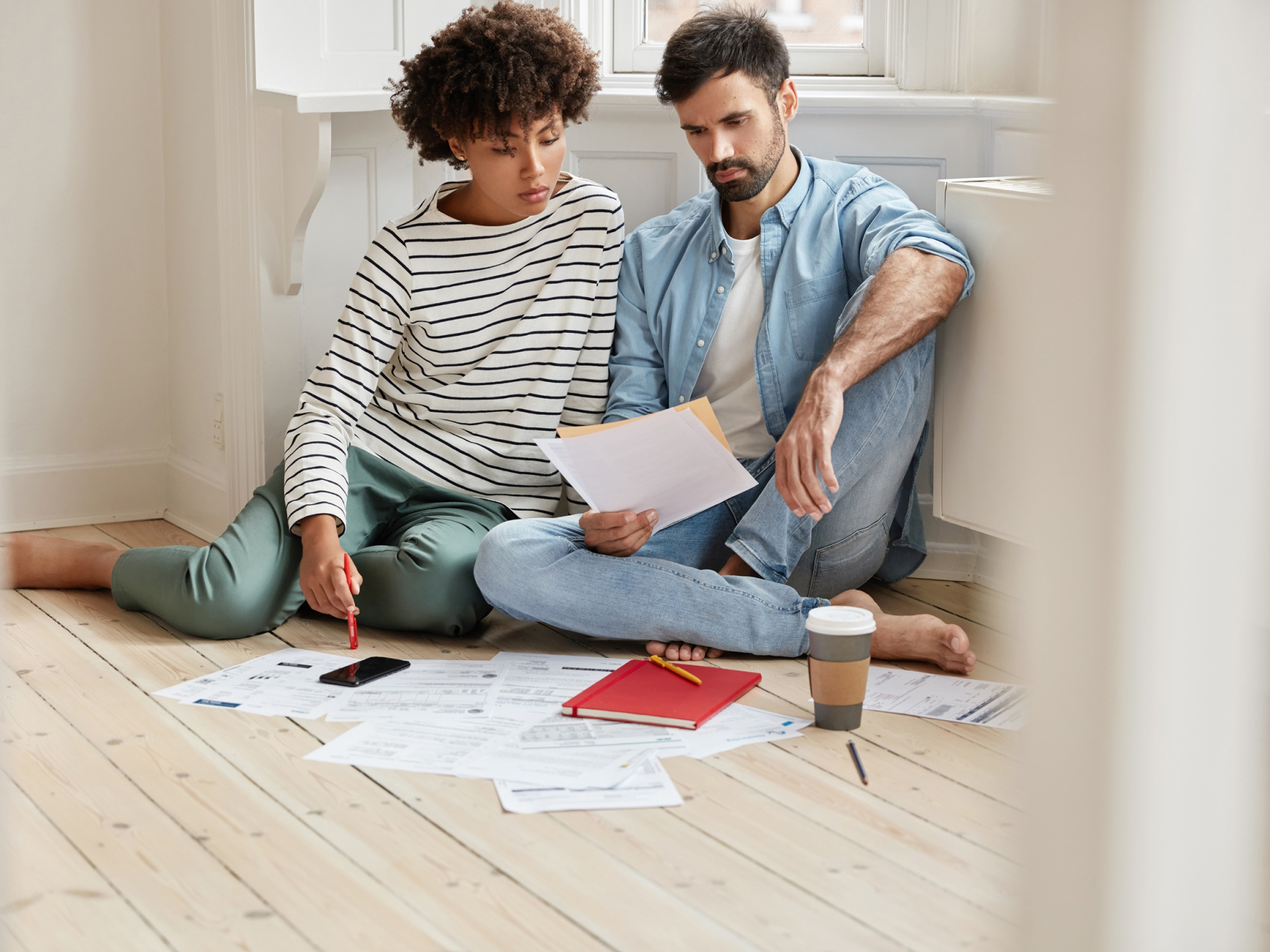 Couple making a checklist and going through their finances