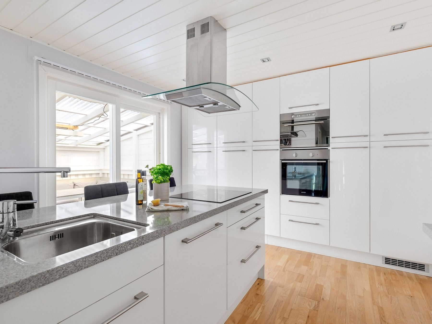 Luxury home kitchen with white counters and cupboards