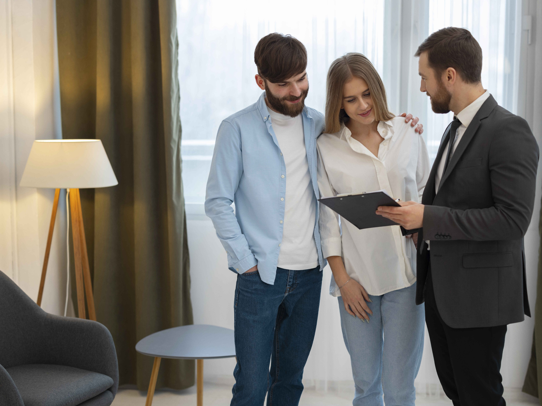 An estate agent guides a couple