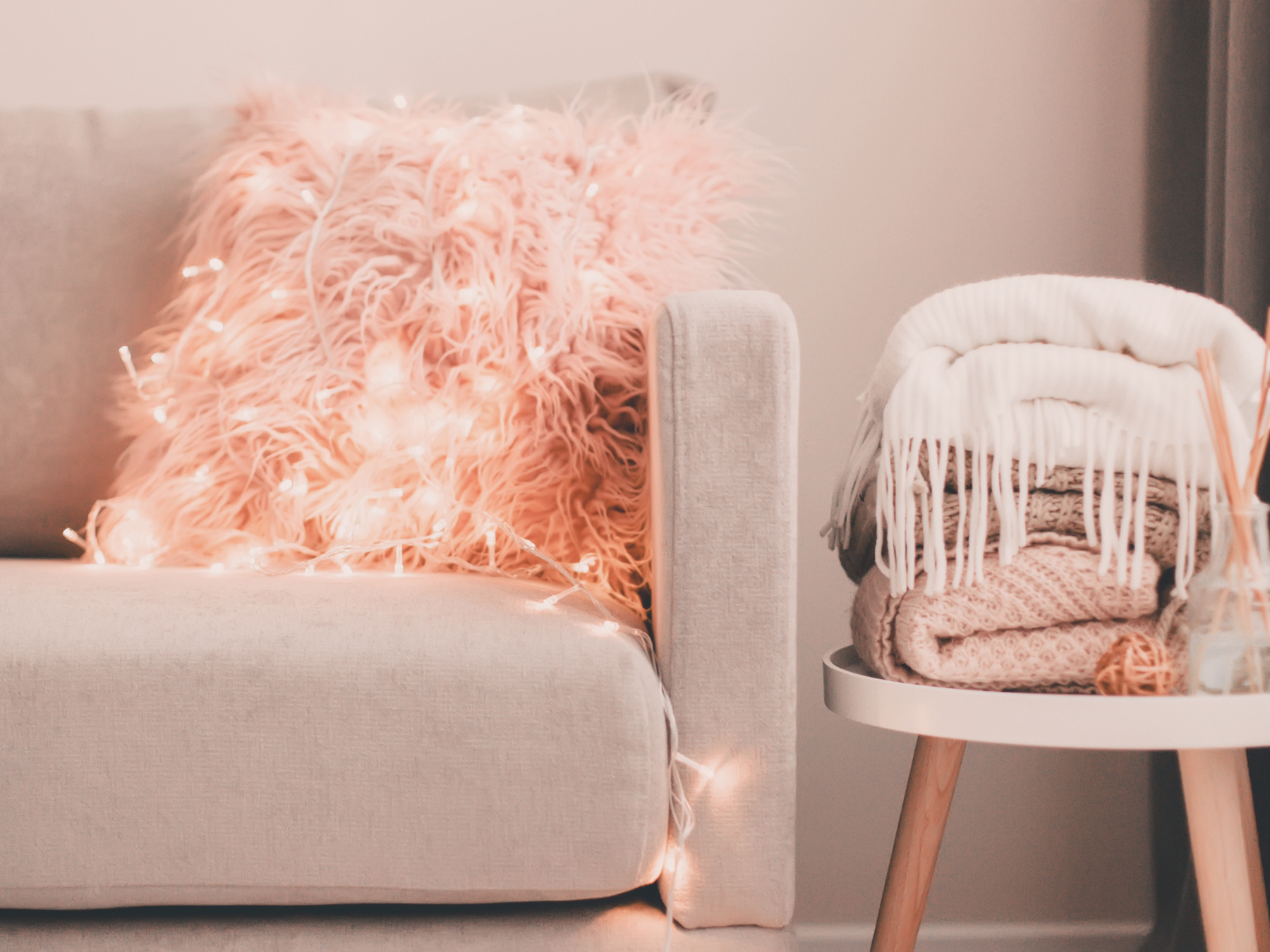 Peach fuzz themed living room with peach fuzz coloured furry cushion