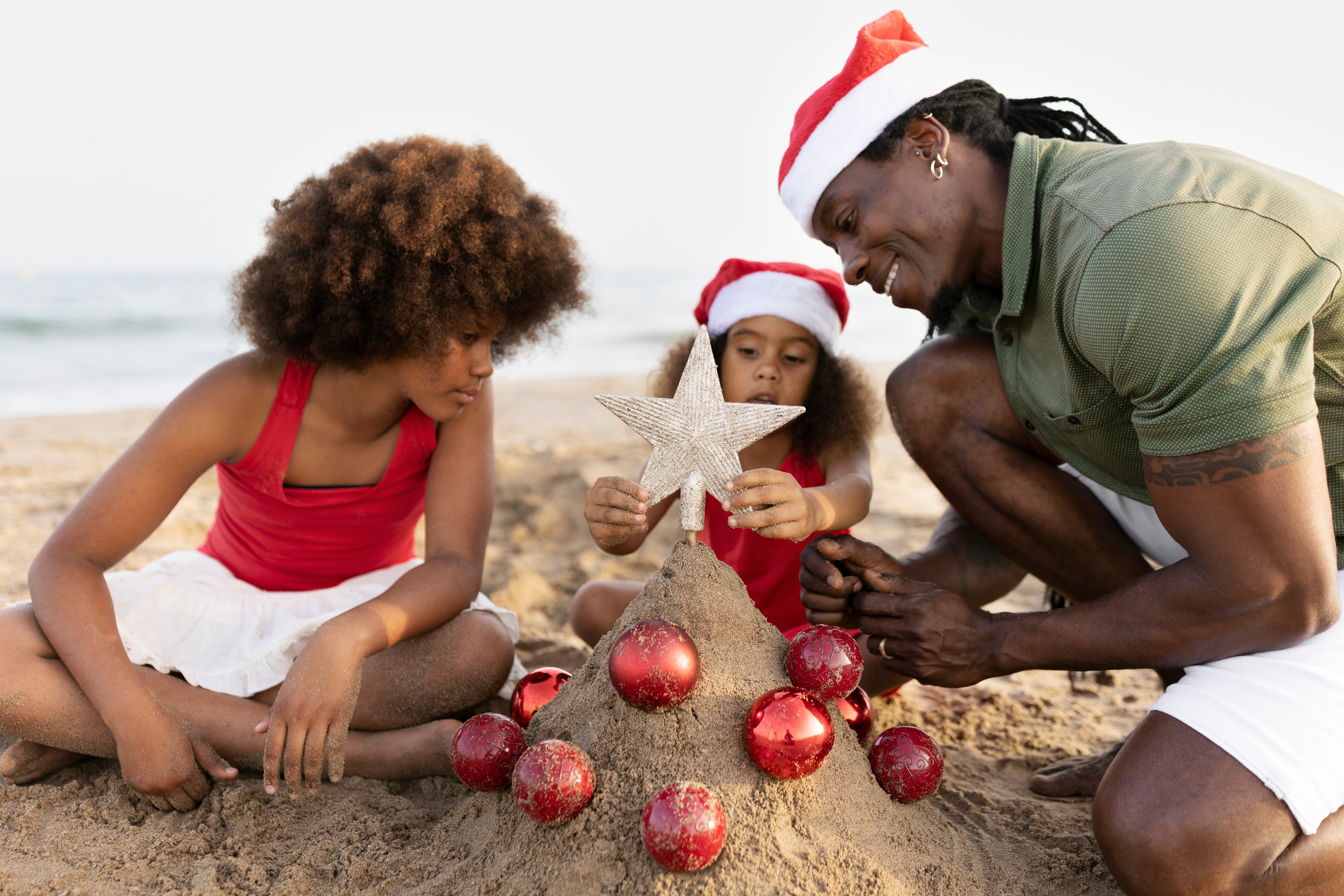 side-view-happy-family-beach-decorating